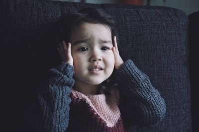 Cute girl on sofa at home