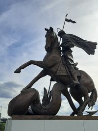 Low angle view of statue against sky