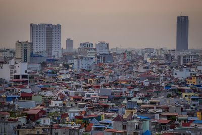 High angle view of buildings in city against sky