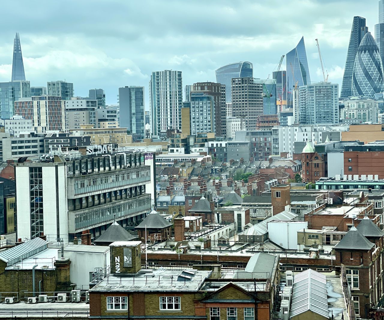 HIGH ANGLE VIEW OF MODERN BUILDINGS IN CITY