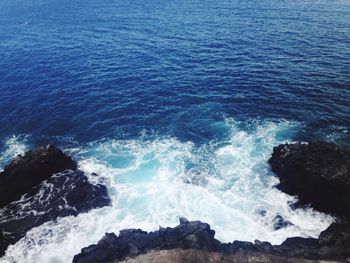 High angle view of sea against blue sky