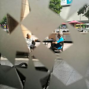 Rear view of woman sitting in bus