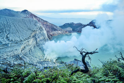 Scenic view of volcanic mountain against sky