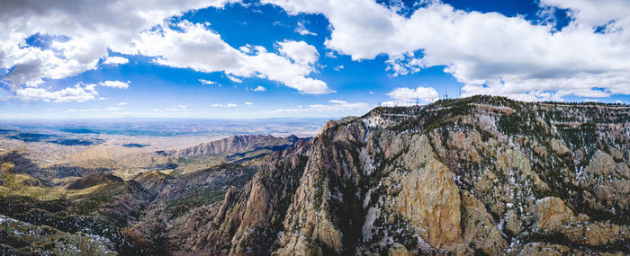 Panoramic view of landscape against cloudy sky