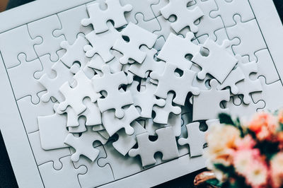 Directly above shot of jigsaw puzzle pieces on table