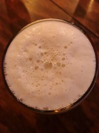 Directly above shot of beer glass on table