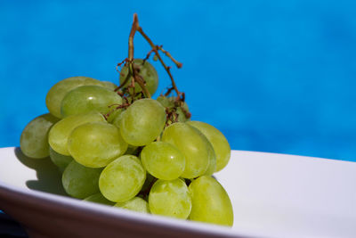 Close-up of grapes on table