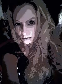 Close-up portrait of young woman in water