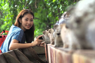 Portrait of young woman standing outdoors