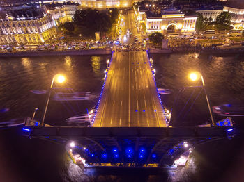 High angle view of illuminated buildings in city at night