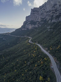 Van on a windy road in the mountains