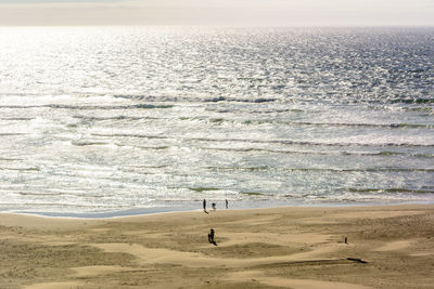 Scenic view of beach and sea against sky