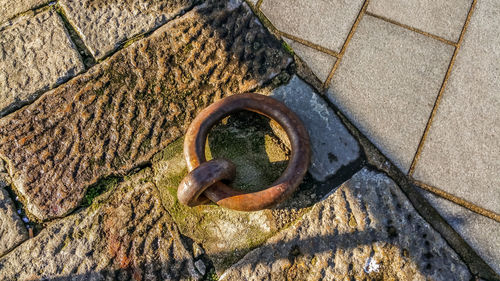 High angle view of ring on footpath