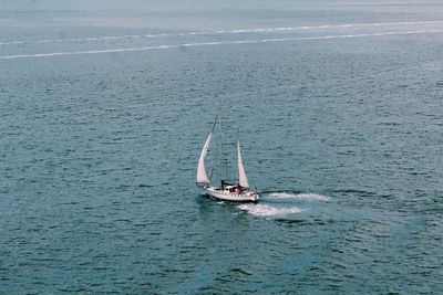 Boat sailing in sea against sky