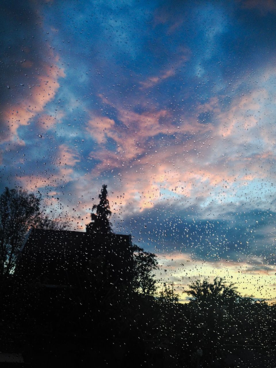 sky, water, cloud - sky, sunset, silhouette, scenics, cloud, weather, cloudy, tranquil scene, beauty in nature, window, wet, nature, transparent, tranquility, dusk, tree, reflection, glass - material