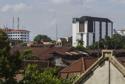 Buildings in city against sky