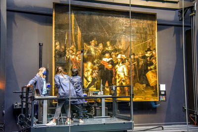 People working in glass window