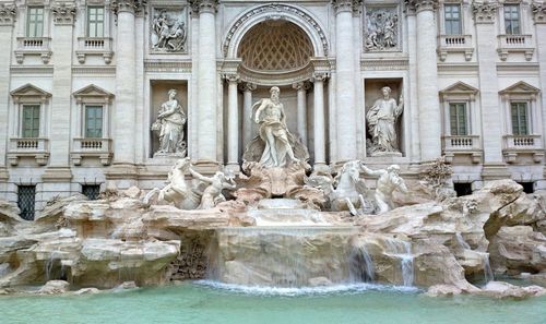 Fountain in front of historical building