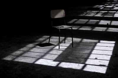 Empty chair in sunlight