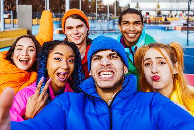 Portrait of smiling friends in park