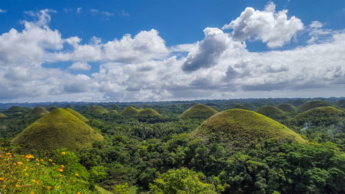 Scenic view of chocolate hills against sky