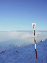 Scenic view of mountains against blue sky