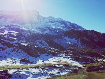 Scenic view of snow covered mountains