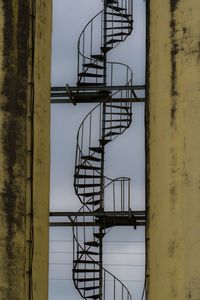 Low angle view of spiral staircase against sky