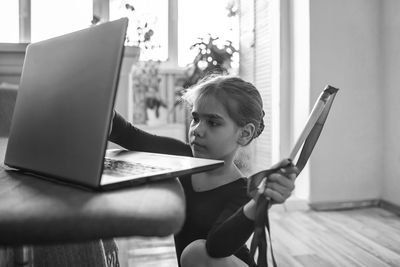 Woman using mobile phone at home