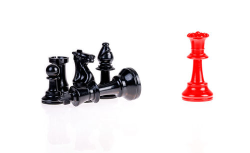 Full frame shot of chess pieces against white background