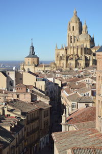 Low angle view of buildings against clear blue sky