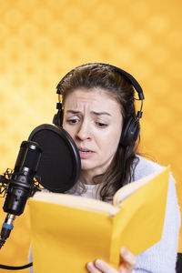 Portrait of young woman using mobile phone