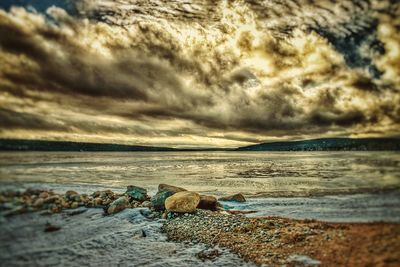 Scenic view of beach against sky during sunset