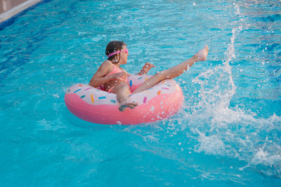 Girl swimming in pool