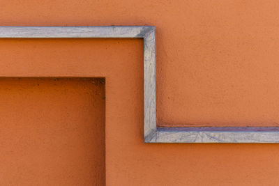 Close-up of orange wall of building