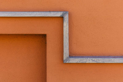 Close-up of orange wall of building