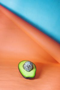 High angle view of avocado on colorful  table