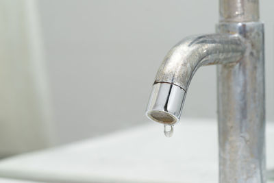 Close-up of water from faucet in bathroom