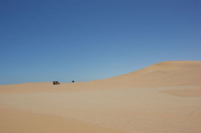 Scenic view of desert against clear sky