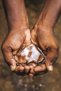 Close-up of man holding hands