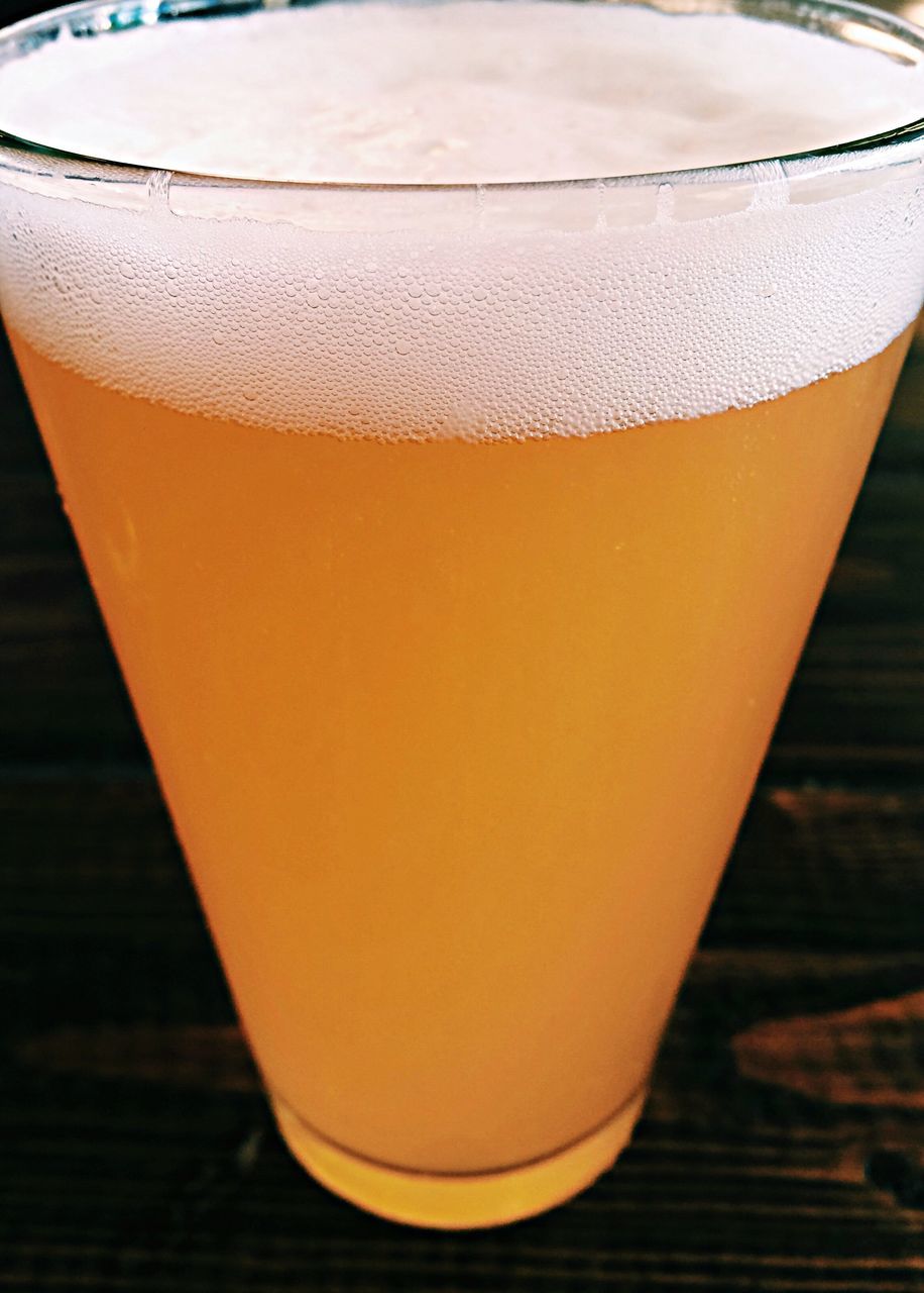 indoors, table, close-up, drink, still life, single object, no people, focus on foreground, wood - material, refreshment, drinking glass, food and drink, orange color, yellow, day, sunlight, shadow, empty, simplicity, freshness