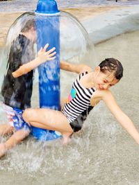 Cheerful friends enjoying at fountain