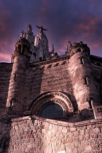 Low angle view of old building against sky