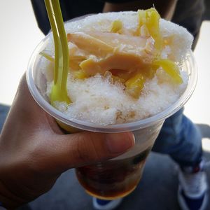 Close-up of hand holding ice cream