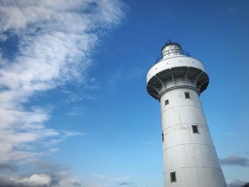 Low angle view of lighthouse against blue sky