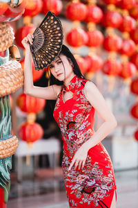 Midsection of woman standing outdoors