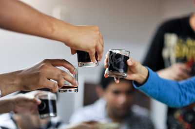 Cropped image of man holding mobile phone