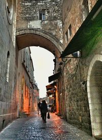 People walking in alley