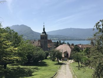 Panoramic view of buildings and mountains against sky