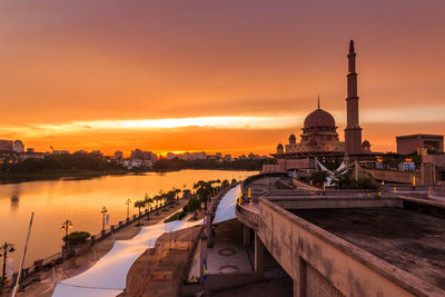 Panoramic view of buildings against sky during sunset